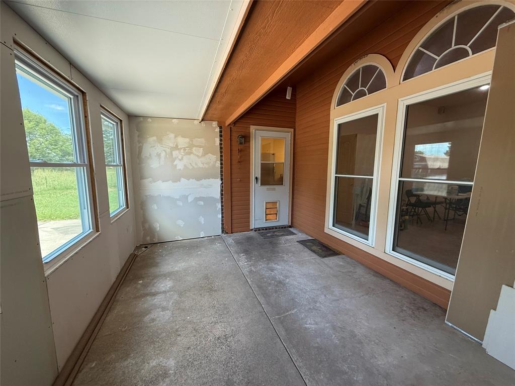3016 County Road 4405 Commerce, TX 75428 - Photo 16 of 40 a view of a house with a large window