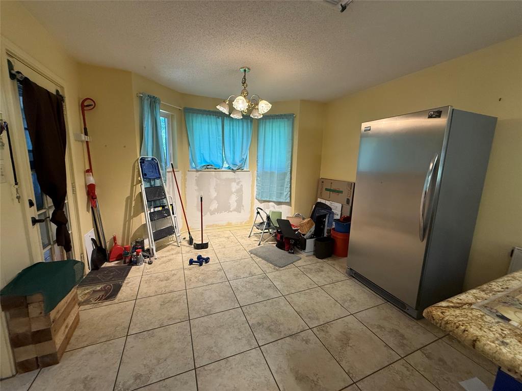 3016 County Road 4405 Commerce, TX 75428 - Photo 17 of 40 a view of a room with gym equipment