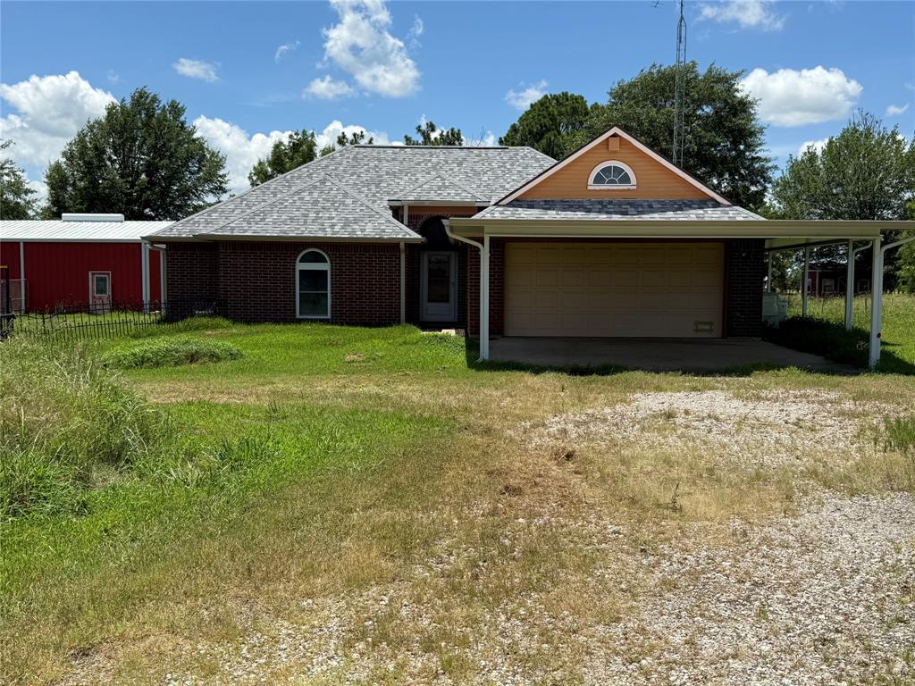 3016 County Road 4405 Commerce, TX 75428 - Photo 2 of 40 a front view of a house with a yard