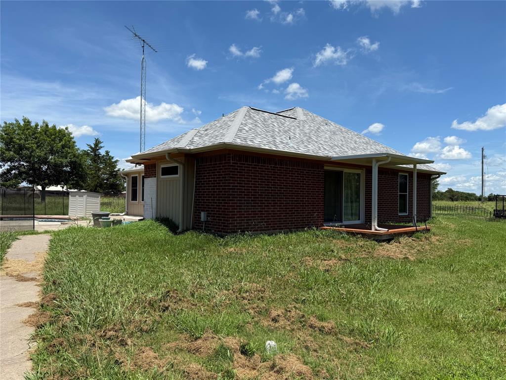3016 County Road 4405 Commerce, TX 75428 - Photo 24 of 40 a view of a house with a backyard