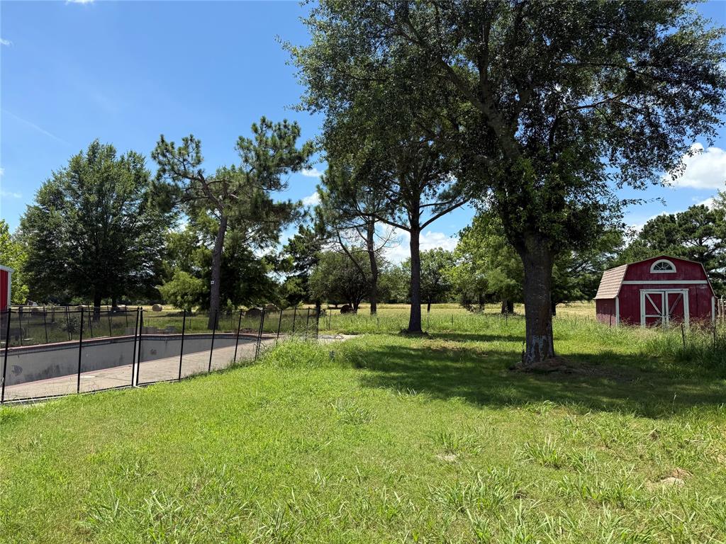 3016 County Road 4405 Commerce, TX 75428 - Photo 29 of 40 a view of a backyard with green space