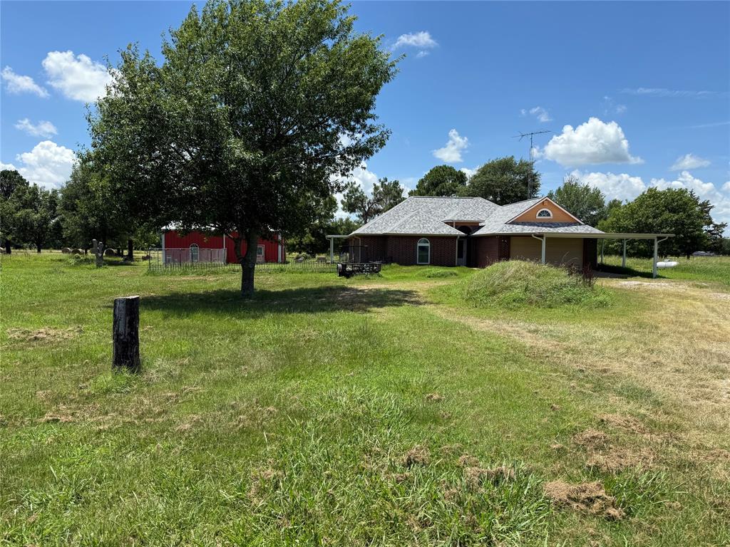 3016 County Road 4405 Commerce, TX 75428 - Photo 38 of 40 a view of a house with a yard