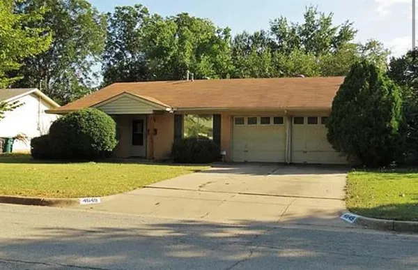a house with a tree in the background