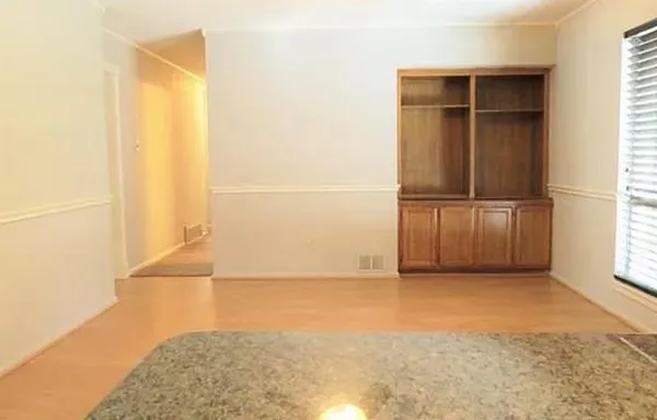 a view of an empty room with a window