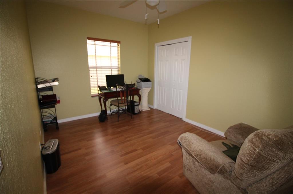 168 Southwest Ridgecrest Drive Port St. Lucie, FL 34953 - Photo 12 of 17 a living room with furniture and a window