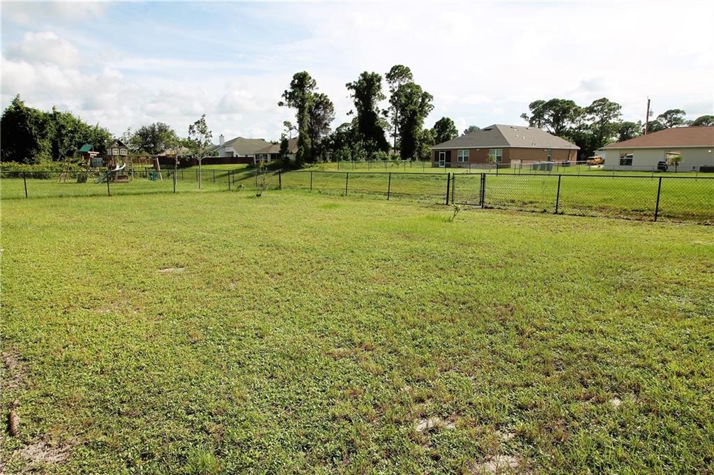 168 Southwest Ridgecrest Drive Port St. Lucie, FL 34953 - Photo 17 of 17 a view of a golf course with a lake