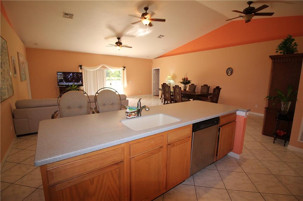 168 Southwest Ridgecrest Drive Port St. Lucie, FL 34953 - Photo 2 of 17 a view of a double sink and a refrigerator