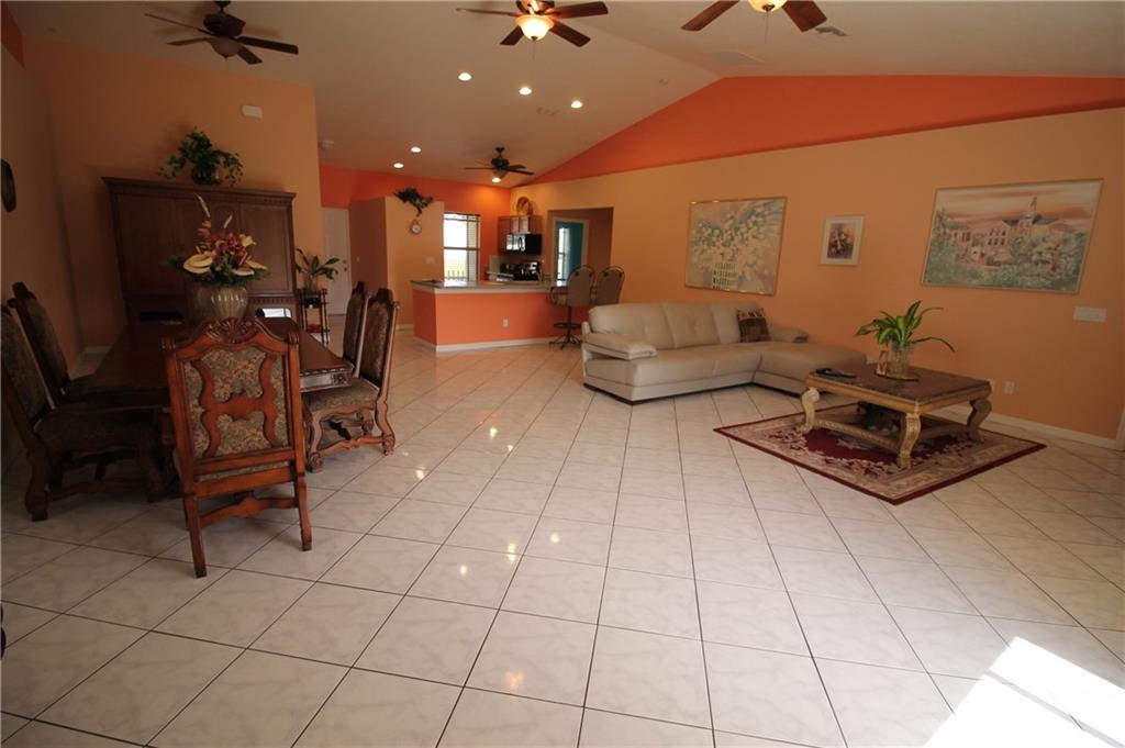 168 Southwest Ridgecrest Drive Port St. Lucie, FL 34953 - Photo 3 of 17 a living room with furniture