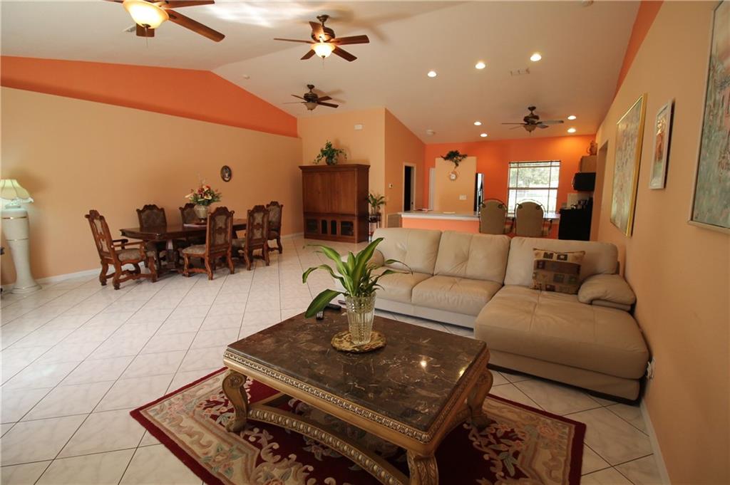 168 Southwest Ridgecrest Drive Port St. Lucie, FL 34953 - Photo 5 of 17 a living room with furniture and wooden floor