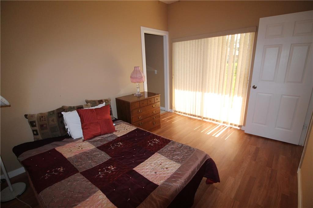 168 Southwest Ridgecrest Drive Port St. Lucie, FL 34953 - Photo 10 of 17 a living room with a couch