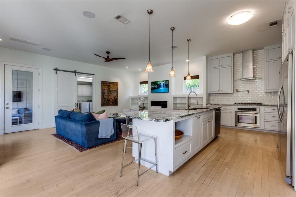 4206 Manning Lane Dallas, TX 75220 - Photo 11 of 35 a kitchen with stainless steel appliances granite countertop a stove oven and a refrigerator
