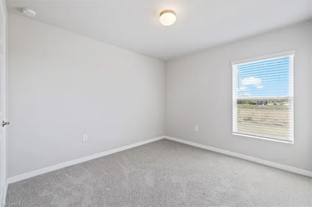 a bathroom with a granite countertop sink mirror toilet and bathtub