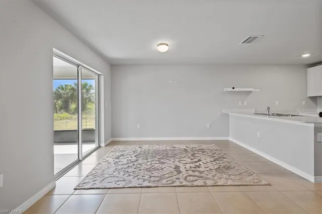 a view of an empty room and window