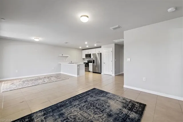 a view of an empty room and window