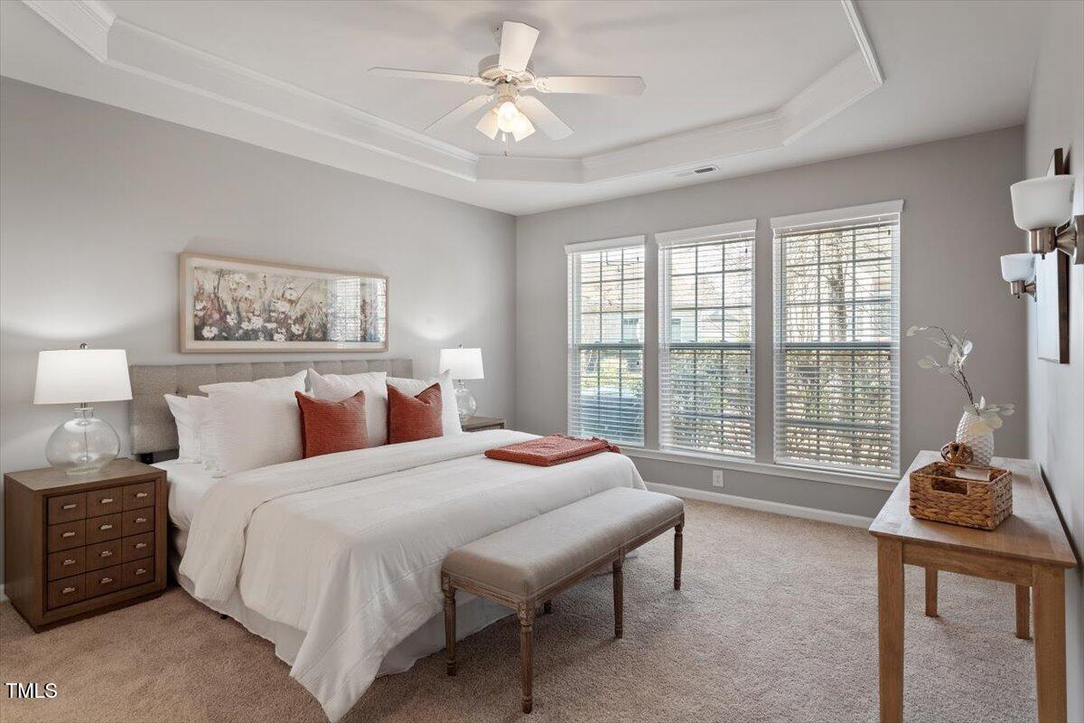 812 Gillinder Place Cary, NC 27519 - Photo 21 of 59 a bedroom with a bed and a large window