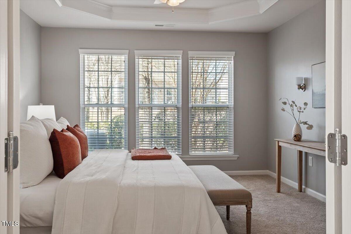 812 Gillinder Place Cary, NC 27519 - Photo 23 of 59 a bedroom with a bed and a large window