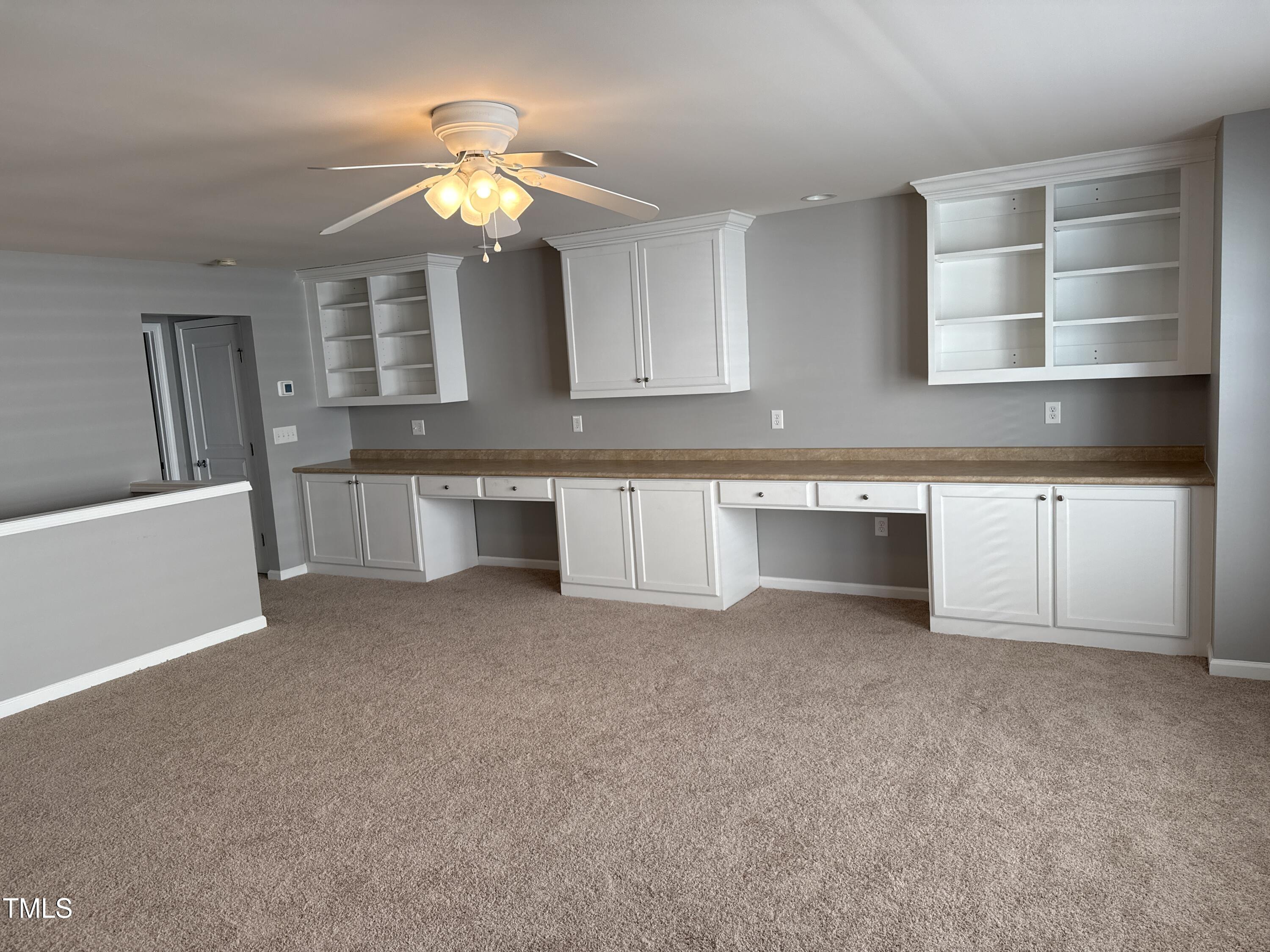 812 Gillinder Place Cary, NC 27519 - Photo 28 of 59 a view of a kitchen with a sink cabinets and a window