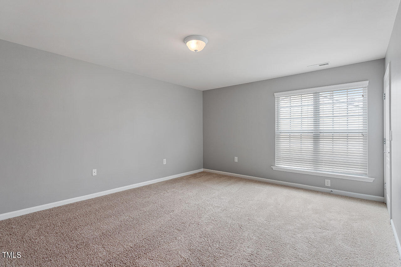 812 Gillinder Place Cary, NC 27519 - Photo 30 of 59 an empty room with a empty space and windows