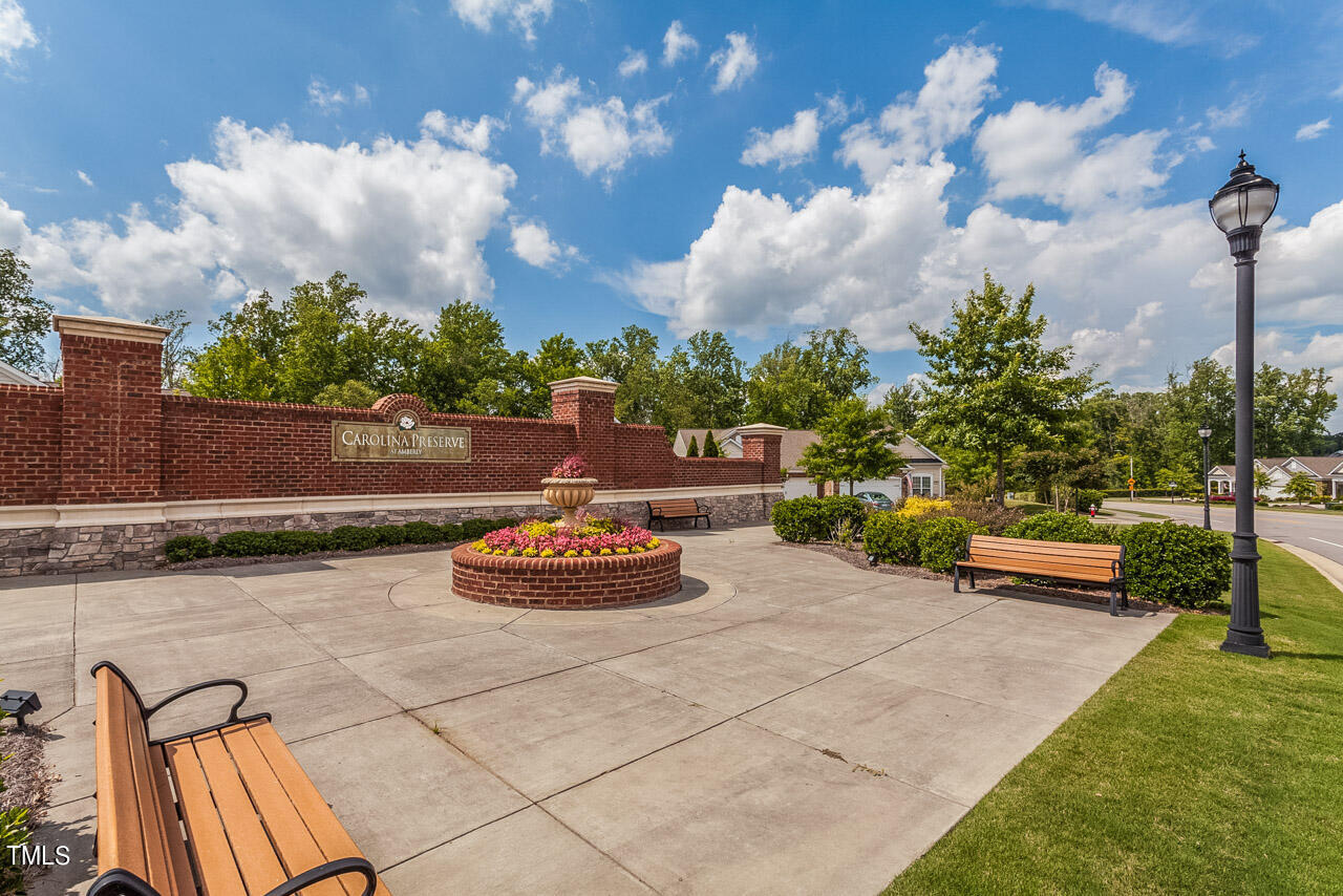 812 Gillinder Place Cary, NC 27519 - Photo 37 of 59 a view of a backyard with plants and a patio