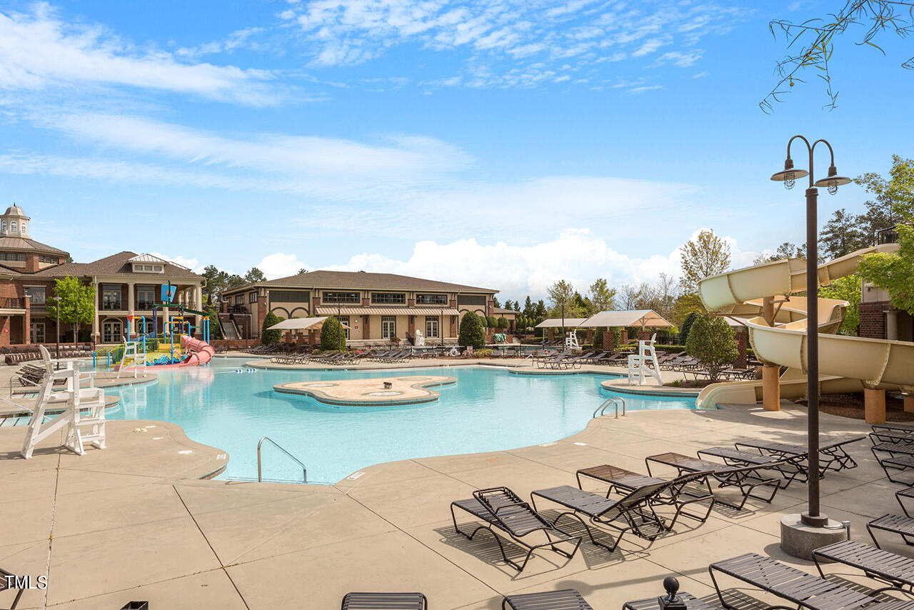 812 Gillinder Place Cary, NC 27519 - Photo 41 of 59 a view of a lake with chairs
