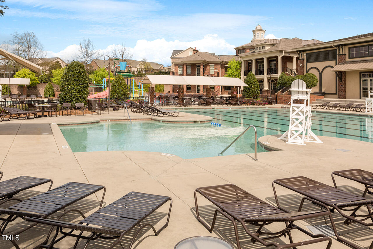 812 Gillinder Place Cary, NC 27519 - Photo 43 of 59 a view of a swimming pool with lounge chairs