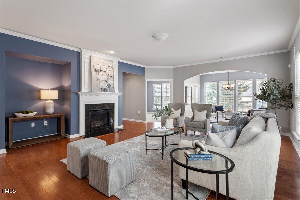 812 Gillinder Place Cary, NC 27519 - Photo 5 of 59 a living room with furniture and a fireplace
