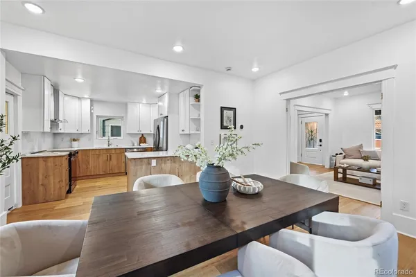 a kitchen with a table and chairs