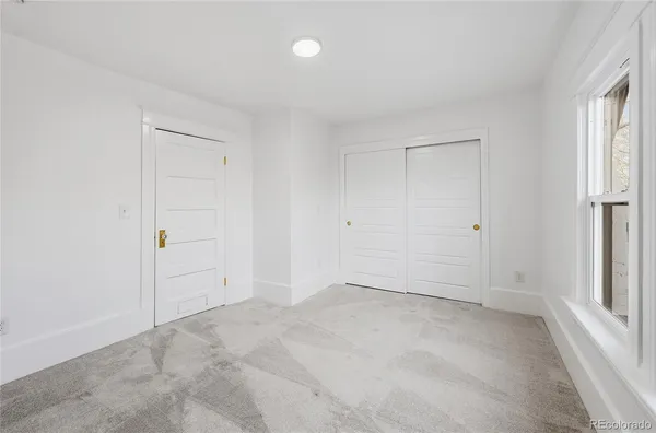 an empty room with white walls