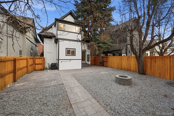 a backyard of house with a stove and refrigerator