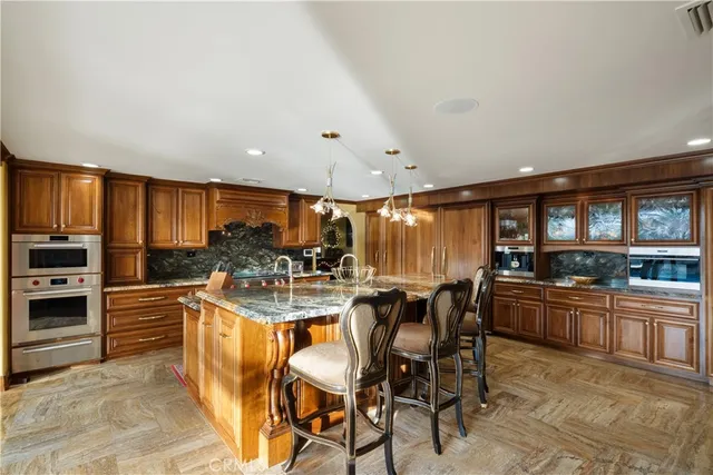 a bed sitting in a spacious bedroom next to a window