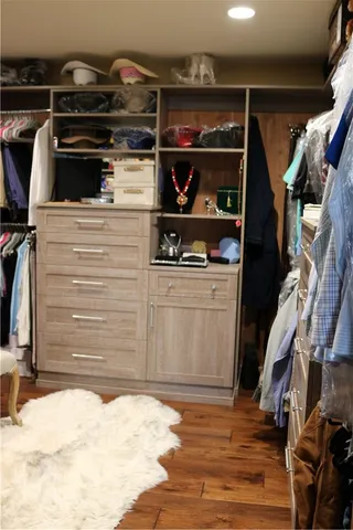 a view of a patio with table and chairs potted plants with wooden floor