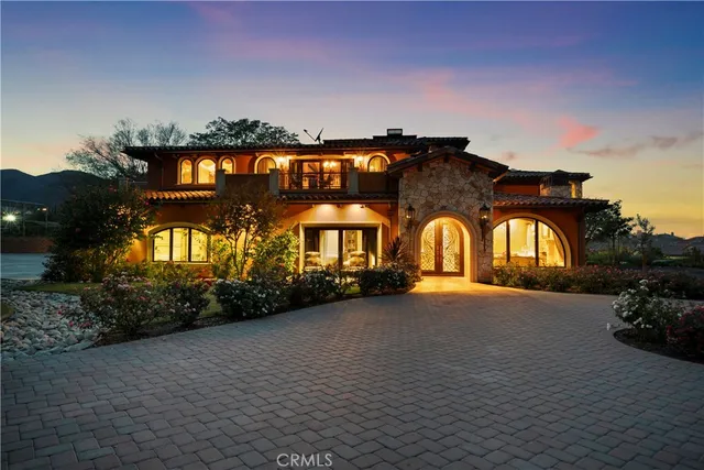 a front view of a house with parking space