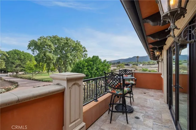 a view of living room with patio furniture and a backyard