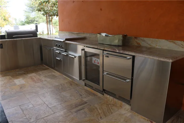 a en suite bathroom with a double vanity sink and a mirror