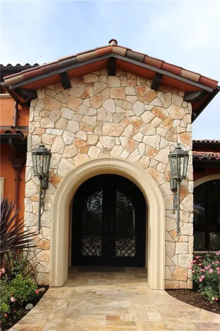 a spacious bedroom with a bed and large window