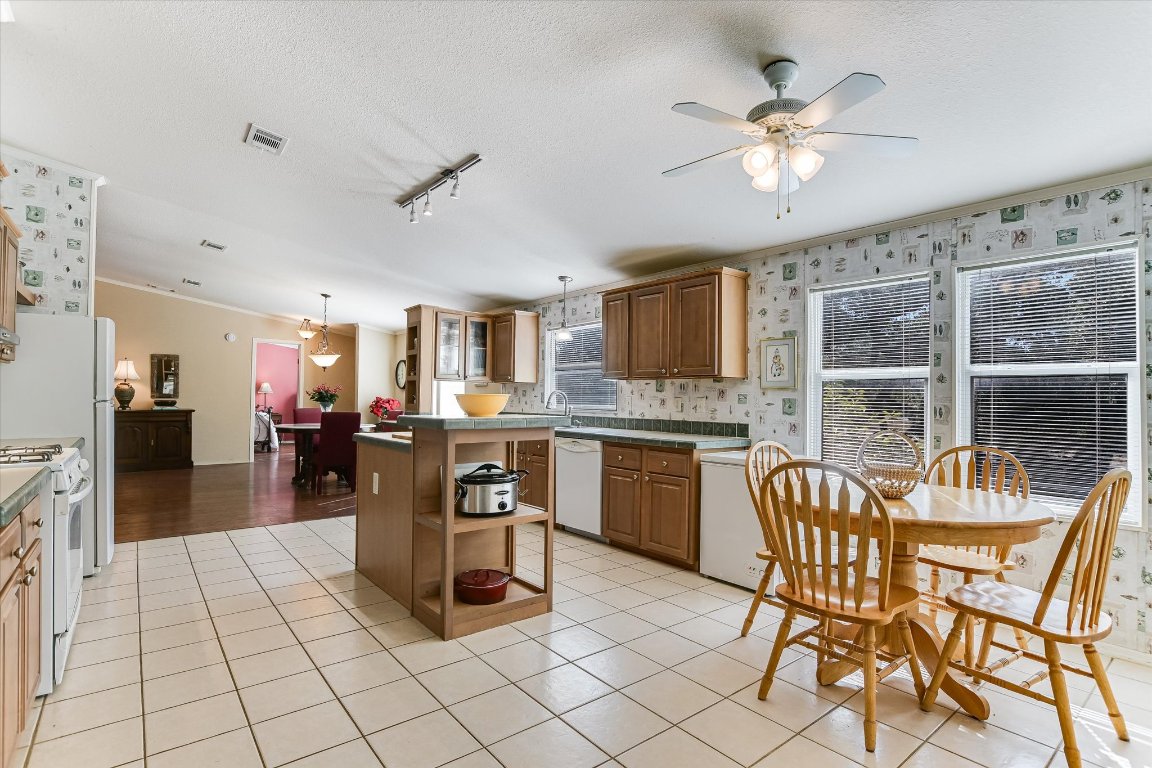 5300 Fischer Store Road Wimberley, TX 78676 - Photo 7 of 20 a view of a dining room with furniture