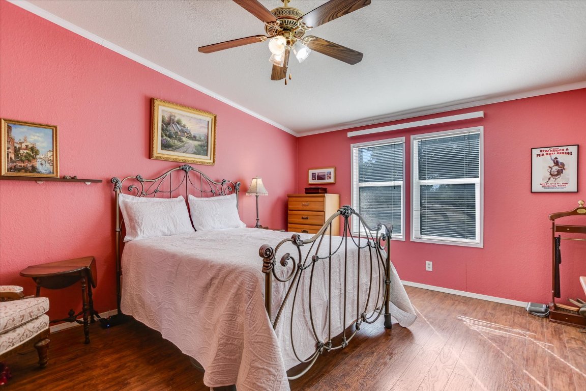 5300 Fischer Store Road Wimberley, TX 78676 - Photo 8 of 20 a bedroom with a bed and a window