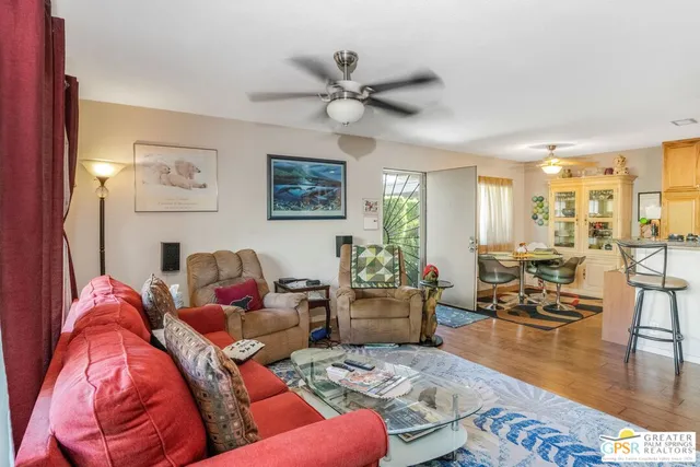 a living room with furniture or couch and a view of kitchen