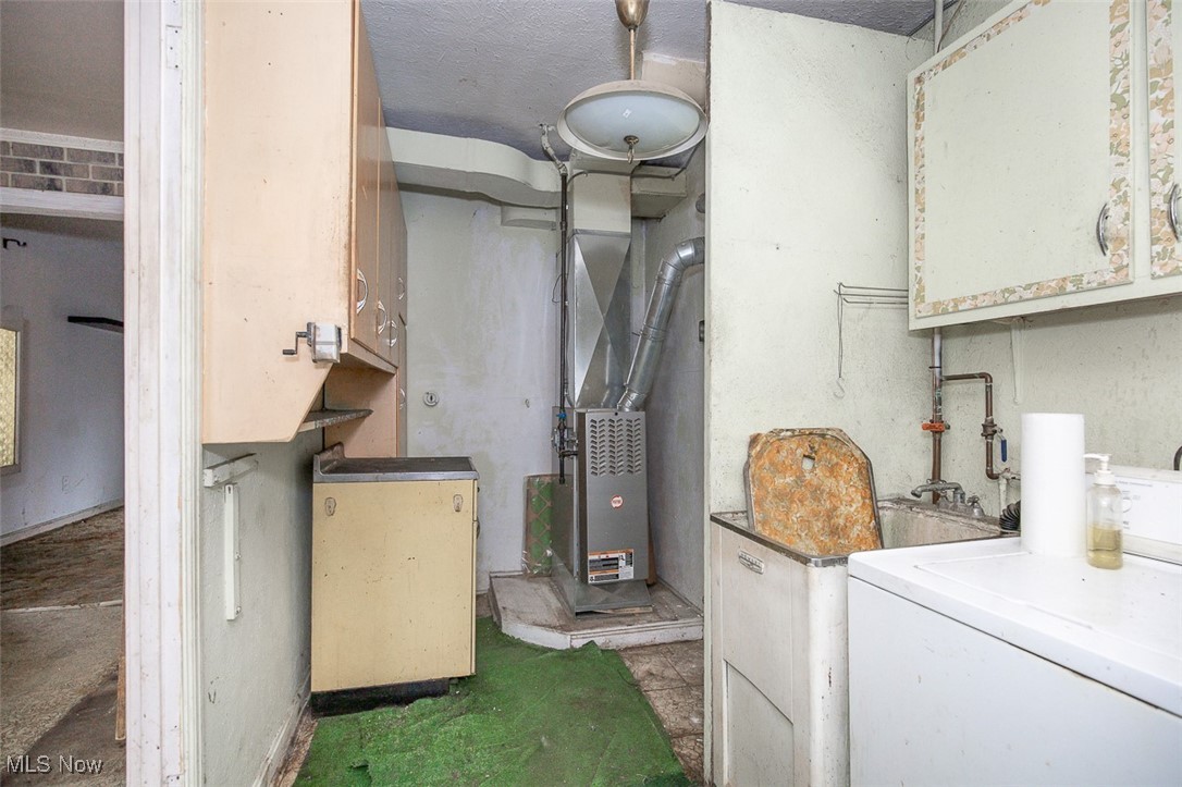 23901 Colbourne Road Euclid, OH 44123 - Photo 8 of 18 Laundry area with washer / clothes dryer and heating unit