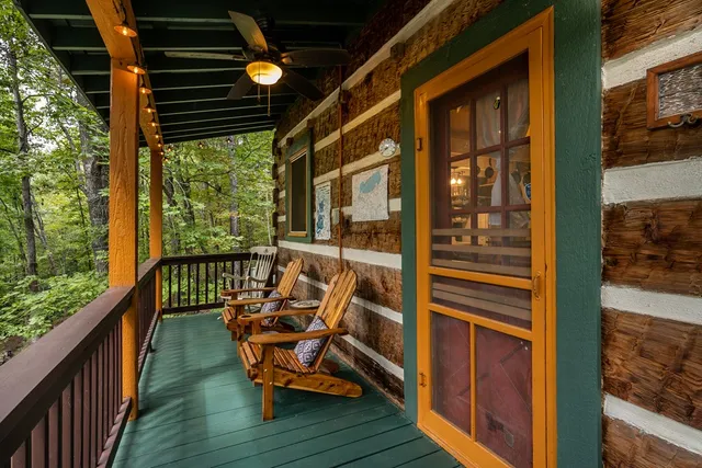 a view of two chairs in a balcony