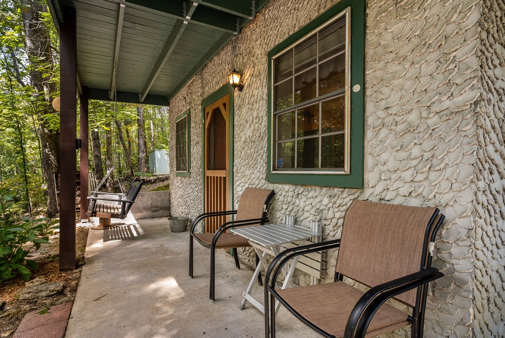 151 Pinewood Drive Murphy, NC 28906 - Photo 30 of 43 a view of a patio with table and chairs and potted plants
