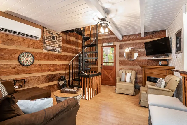 a living room with furniture and a flat screen tv