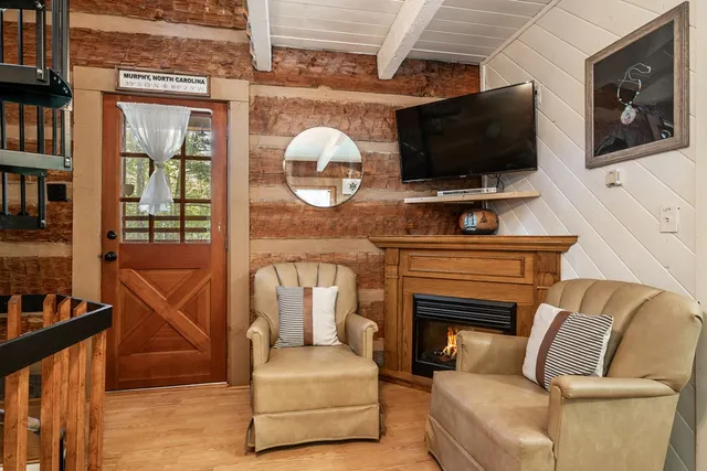 a living room with furniture and a flat screen tv