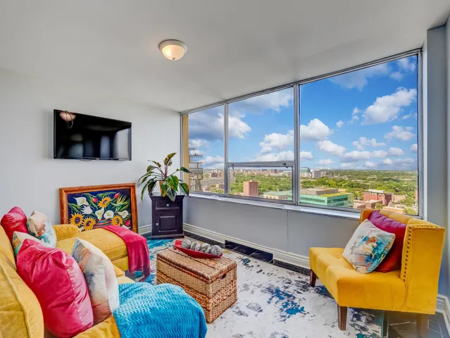 a bed room with furniture and a window
