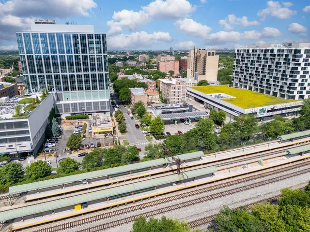 a view of a balcony with yard