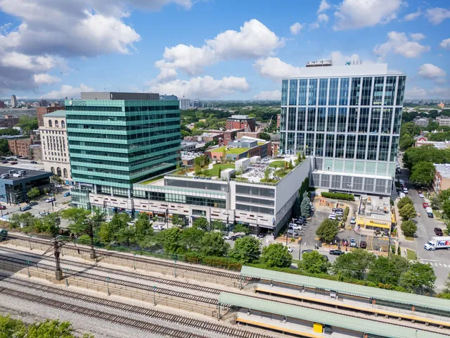 a view of building with yard and staircase