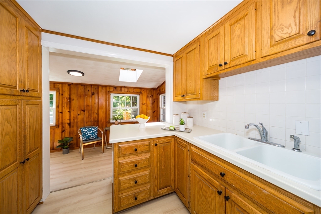 6 MacArthur Road Natick, MA 01760 - Photo 11 of 31 a kitchen with a sink cabinets and wooden floor
