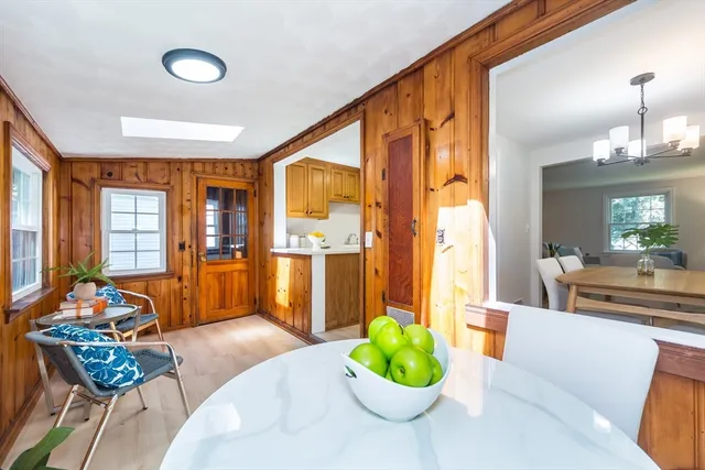 a living room with furniture and potted plants