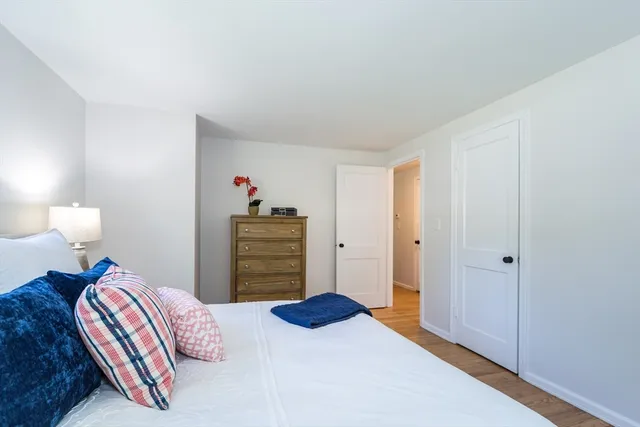 a bedroom with a bed and a closet