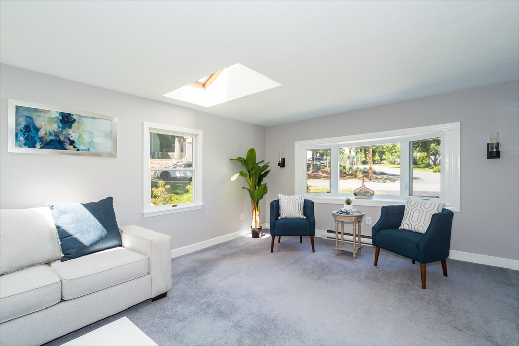 6 MacArthur Road Natick, MA 01760 - Photo 21 of 31 a living room with furniture and a potted plant
